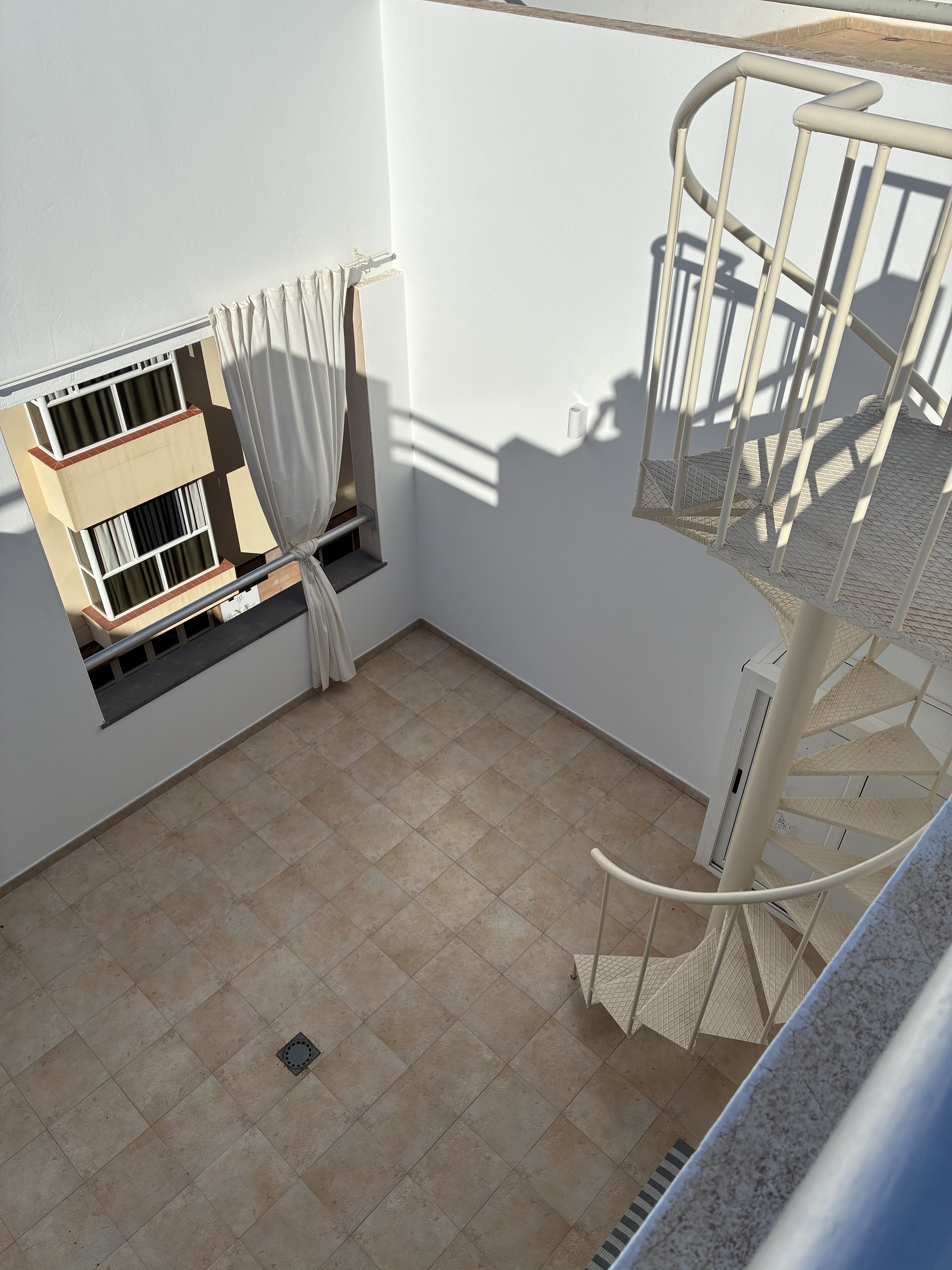 Bluebird Home rooftop town view